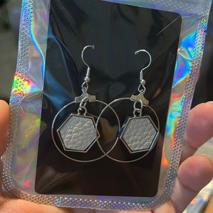 Silver drop down circle with cream leather accents earrings